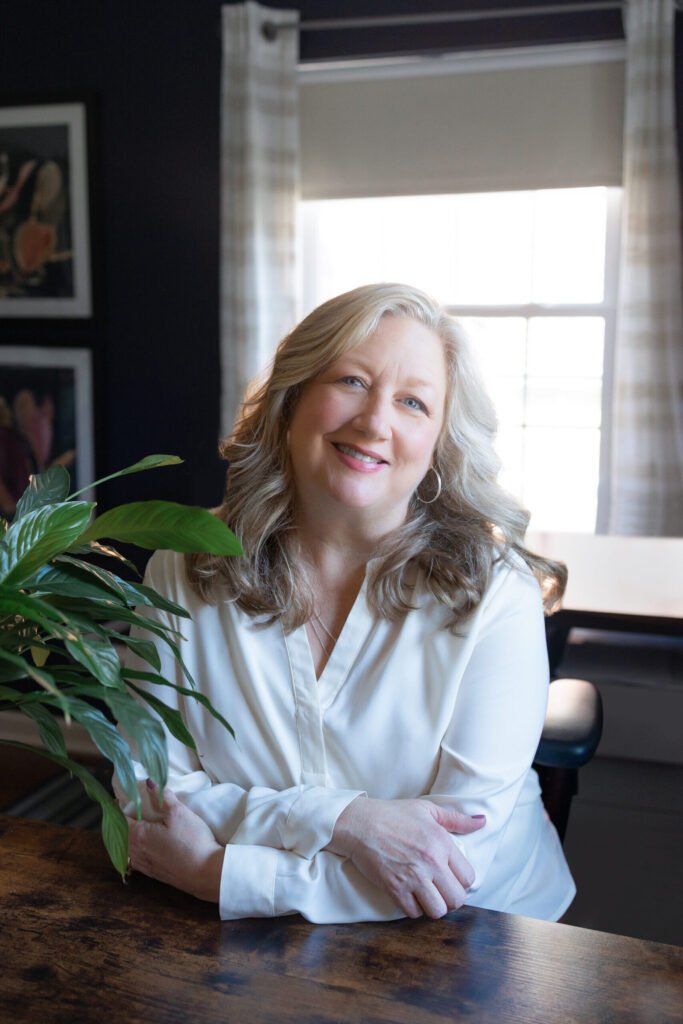 Kate Bergman smiling in her Beachwood, Ohio therapy office